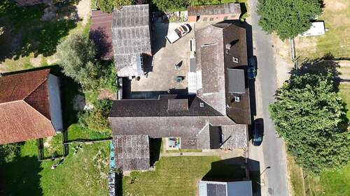 Luftbild - 2 Zimmer Mehrfamilienhaus, Wohnhaus zum Kaufen in Wrestedt