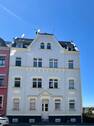 Ansicht Strassenseite - Mehrfamilienhaus teilweise vermietet mit Sanierungsbedarf