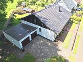 Luftaufnahme Front-/Seitenansicht - 4 Zimmer Einfamilienhaus in Loxstedt