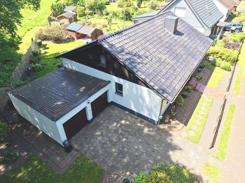 Luftaufnahme Front-/Seitenansicht - 4 Zimmer Einfamilienhaus in Loxstedt