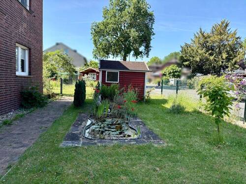 Der Gemeinschaftsgarten mit Gartenhäuschen - 