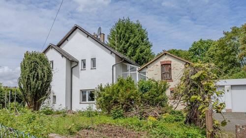 Frontseite - Freistehendes Einfamilienhaus mit großem Grundstück, Doppelgarage & vielseitigem Potenzial in Gründau