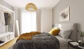 Durch bodentiefe Fenster wird das Schlafzimmer hel - 