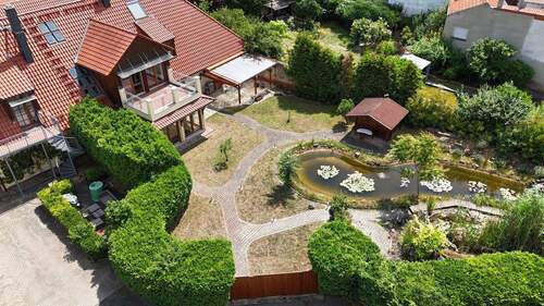 Gartenansicht Wohnhaus - 3 Zimmer Mehrfamilienhaus, Wohnhaus in Flonheim