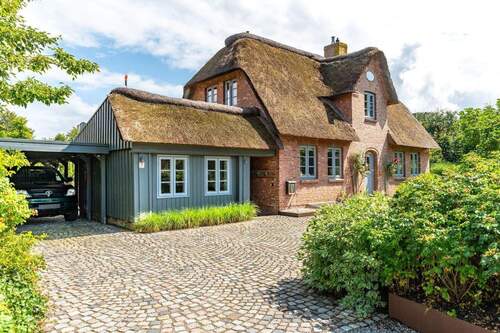 Westansicht mit Anbau und Carport - 