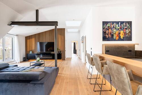 Wohnzimmer - AIGNER - Erstbezug! Exklusives Penthouse: Design-Highlight in Bestlage Harlaching