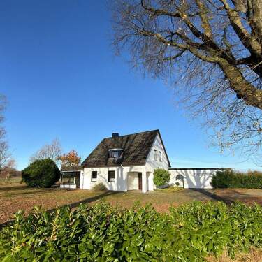 Titelbild - Familienidylle im Grünen - Charmantes Einfamilienhaus mit großem Garten in Moorrege