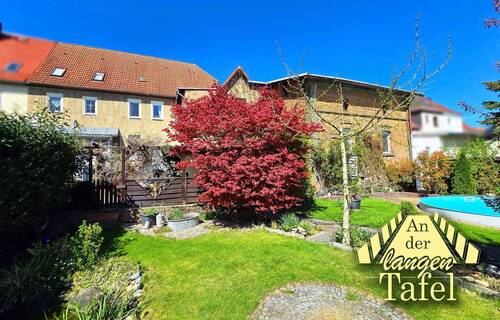 Einfamilienhaus - An der langen Tafel - Großzügiges Wohnhaus mit Gartenidylle, Wintergarten & einzigartigem Familienbereich in Gröbzig