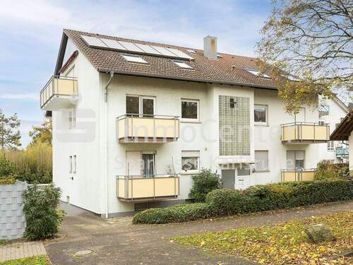 Außenansicht - Investition mit Perspektive: Sanierungsbedürftige Wohnung mit 2 Balkonen und Garage in Wolfartsweier