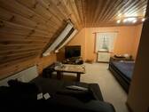 Wohnzimmer DG Wohnung Haupthaus - 