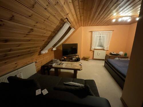 Wohnzimmer DG Wohnung Haupthaus - 