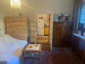 Wohnzimmer mit Kachelofen Bild 1 - 
