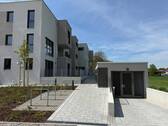 Objektansicht - EG Wohnung im Neubau KFW 55 mit kleinem Garten - A+ - Glasfaser - 2 TG Stellplätze