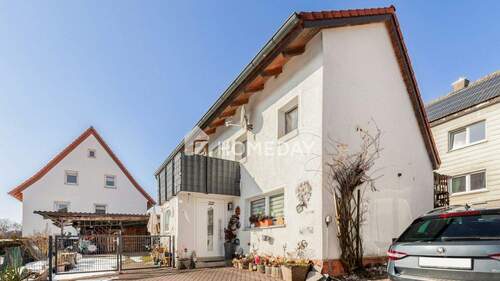 Außenansicht 1 - Charmantes Einfamilienhaus mit durchdachter Raumaufteilung und sonnigem Balkon