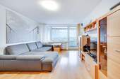 Wohnzimmer - AIGNER - Charmante 3-Zimmer Wohnung mit durchdachtem Raumkonzept