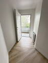 Ausgang - Familienfreundliche 4-Zimmer-Wohnung mit Balkon und moderner Raumaufteilung