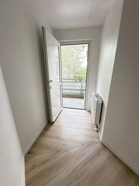 Ausgang - Familienfreundliche 4-Zimmer-Wohnung mit Balkon und moderner Raumaufteilung