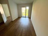 Ansicht I: Wohn- und Esszimmer mit offenem Küchenbereich - 2-Zimmer-Neubauwohnung mit BALKON und EBK in Hamburg-Langenhorn