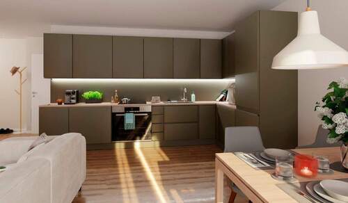 In der offenen Wohnküche bereiten Sie köstliche Ma - Erdgeschosswohnung mit Terrasse und 38 m² Gartenanteil