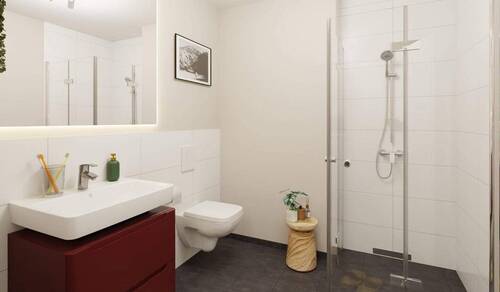 Modern gefliestes Badezimmer mit bodengleicher Dus - Etagenwohnung mit 50,00 m&sup2; in Heringsdorf zum Kaufen