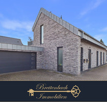 Oyten . Neuwertige Erdgeschosswohnung mit Garten, Doppelgarage & moderner Ausstattung