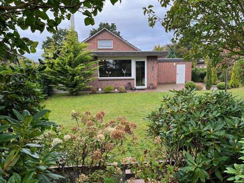 Garten mit Blick zum Haus (1) - 3 Zimmer Einfamilienhaus zum Kaufen in Bockhorn
