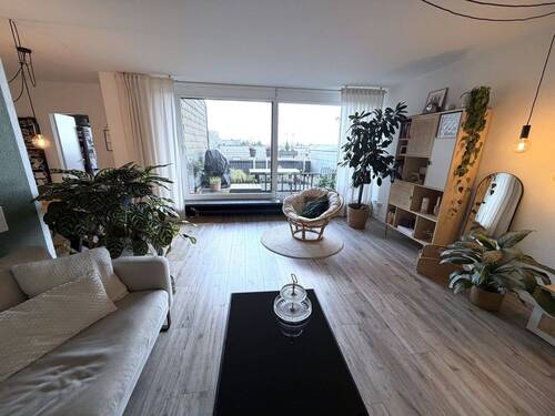 Wohnzimmer Ans. 2.jpeg - 2 Zimmer Terrassenwohnung in Düsseldorf