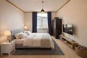 Schlafzimmer (virtuell möbliert) - 2 Zimmer Etagenwohnung zum Kaufen in Düsseldorf