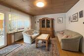 Wohnzimmer mit Zugang zum Wintergarten - 