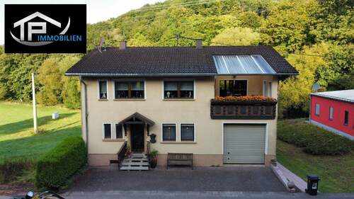 1 Hauptbild - Einfamilienhaus in Alleinlage mit großem Garten und Werkstatt-Garage in Neipel