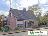 Titelbild - Familienfreundliches Einfamilienhaus mit großem Wintergarten und praktischer Garage in Krempe
