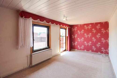 Schlafzimmer im OG mit Zugang zur Dachterrasse - 