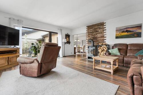 Wohnzimmer mit Kamin - Einfamilienhaus mit 169,00 m&sup2; in Mechernich zum Kaufen