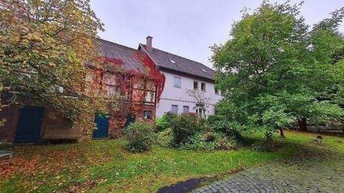 Bild 1 - 8 Zimmer Mehrfamilienhaus, Wohnhaus zum Kaufen in Heinade