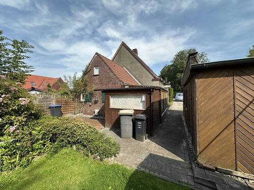 Hinterhof - Einfamilienhaus mit 94,90 m² in Wangerland zum Kaufen
