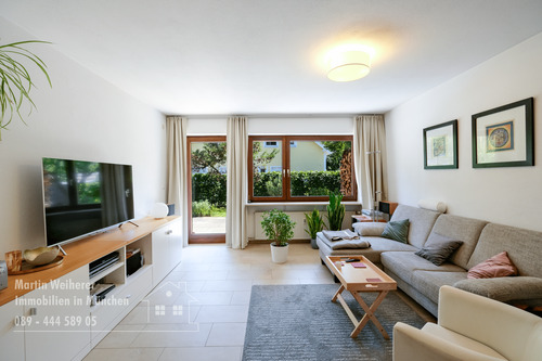 Wohnzimmer Blick zum Garten - Mehrfamilienhaus, Wohnhaus mit 163,90 m² in München zum Kaufen