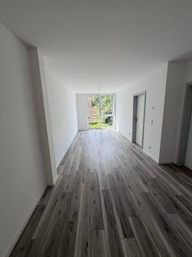 Wohnzimmer - Attraktive Neubauwohnungen in Rahlstedt zu vermieten