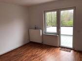 Wohnzimmer - Mehrfamilienhaus, Wohnhaus in Wilhelmshaven