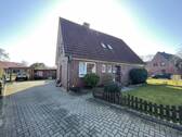 Auffahrt - Mehrfamilienhaus, Wohnhaus mit 140,00 m² in Schortens zum Kaufen