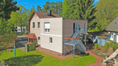 Blick aus dem Garten auf den Neubau - 6 Zimmer Mehrfamilienhaus, Wohnhaus in Falkensee