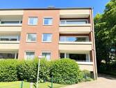 Hausansicht Rückseite - Gut geschnittene Etagenwohnung inkl. Einzelgarage