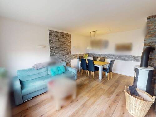 Wohn- und Esszimmer mit Ofen - 5 Zimmer Einfamilienhaus zum Kaufen in Horneburg