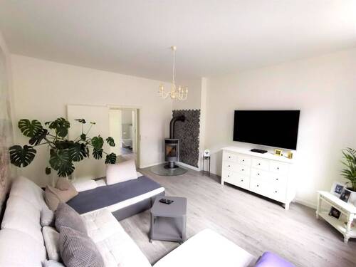 Wohnzimmer mit Kaminofen - 