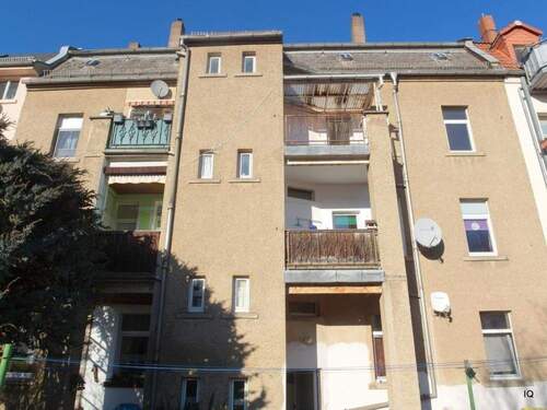 Ansicht Hofseite - Freundliche 3-Zimmer-Wohnung mit Laminatboden 'Dielenoptik', Balkon und modernem Bad m. WanneDusche