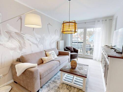 gemütlicher Wohnbereich mit Zutritt zum Balkon - 2 Zimmer Etagenwohnung in Ostseeheilbad Zingst