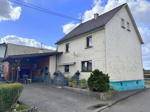 Rückansicht mit Carport - 7 Zimmer Einfamilienhaus zum Kaufen in Bellingen