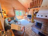 Wohnzimmer mit Kaminofen EG - 