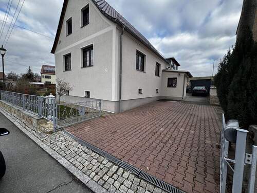 Ansicht 1 - Freistehendes Einfamilienhaus mit pflegeleichtem Grundstück im Grünen zu verkaufen