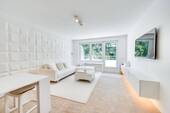 Wohnzimmer - AIGNER - Lichtdurchflutete Penthousewohnung mit umlaufenden Balkon und Nähe zum Perlacher Forst