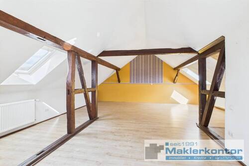 Dachgeschoss/Wohnbereich mit Kamin - 